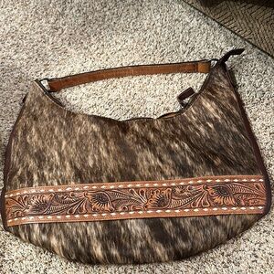 American darling cowhide purse never used
